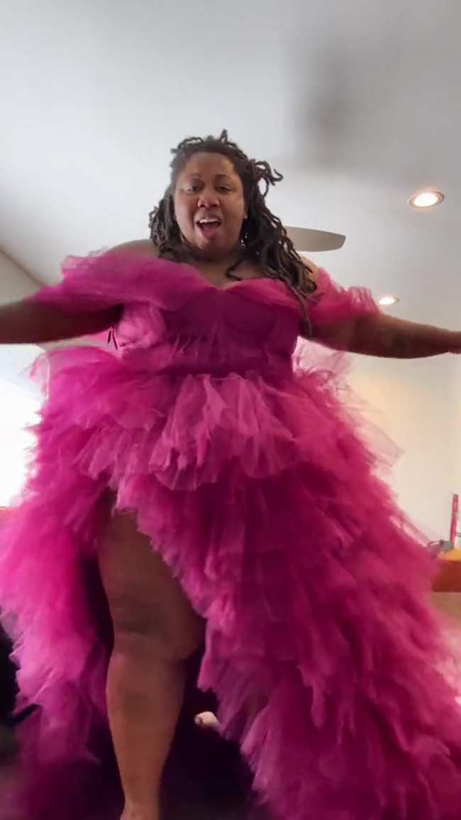              Marie tries on the pink ruffled dress Lizzo sent her            