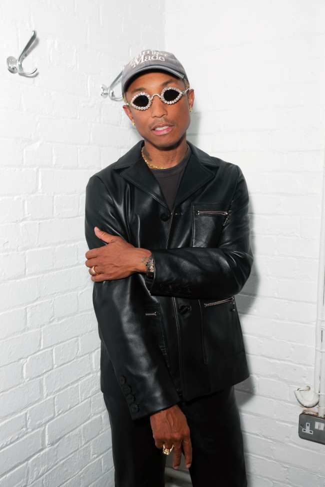              Pharrell donned a pair of sparkly sunglasses at the exclusive event             