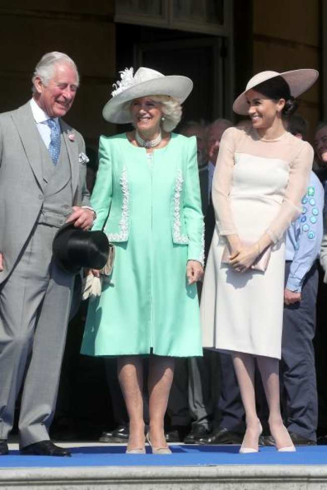 Meghan Markle con el rey Carlos y Camilla Parker Bowles